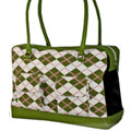 Dashing dog carrier available in original argyle print with leather accents