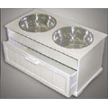 elevated white wood dog diner with dog food storage